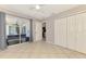 This bedroom features tile floors, closet space, and sliding door access to the backyard at 2759 Starview Ave, North Port, FL 34288