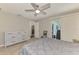 This bedroom features tile floors, fan, and sliding door access to the backyard at 2759 Starview Ave, North Port, FL 34288