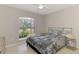 Cozy bedroom with natural light, a window and updated coastal-themed furniture at 2759 Starview Ave, North Port, FL 34288
