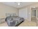 Charming bedroom featuring a ceiling fan, closet, and updated decor at 2759 Starview Ave, North Port, FL 34288