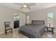 Comfortable bedroom with sliding glass doors leading to a screened lanai at 2759 Starview Ave, North Port, FL 34288