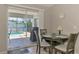 Dining area with view of screened in pool area, table with setting for four, and neutral decor at 2759 Starview Ave, North Port, FL 34288