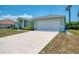 Charming single-story home with a well-maintained lawn and a spacious two-car garage at 2759 Starview Ave, North Port, FL 34288