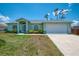 Charming single-story home with well-maintained lawn, landscaping and spacious driveway at 2759 Starview Ave, North Port, FL 34288