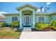 Inviting front entrance with well-manicured landscaping and a screened front door at 2759 Starview Ave, North Port, FL 34288