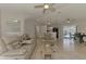 Spacious open living room and dining area with tile floors and plenty of natural light at 2759 Starview Ave, North Port, FL 34288