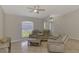 Comfortable living room featuring tile floors, a ceiling fan and neutral paint at 2759 Starview Ave, North Port, FL 34288
