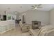 Open-plan living room showcasing tile floors, ceiling fans and a dining area at 2759 Starview Ave, North Port, FL 34288
