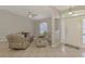 Inviting living room featuring tile floors, ceiling fan, and a bright airy feel at 2759 Starview Ave, North Port, FL 34288