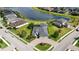 Stunning aerial view of home, pool, lush landscaping, and brick driveway at 308 Chantilly Trl, Bradenton, FL 34212