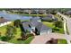 Aerial view showing home, in a lakeside community, with a three-car garage at 308 Chantilly Trl, Bradenton, FL 34212