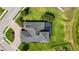 Aerial view of the property showcasing lush landscaping, a pool and screened in lanai at 308 Chantilly Trl, Bradenton, FL 34212