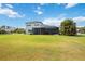 Expansive backyard with screened lanai provides ample space for outdoor activities at 308 Chantilly Trl, Bradenton, FL 34212