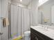Well-lit bathroom featuring a shower with a neutral colored curtain and vanity at 308 Chantilly Trl, Bradenton, FL 34212