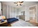 This is a bedroom with neutral walls, ceiling fan, and access to the bathroom at 308 Chantilly Trl, Bradenton, FL 34212