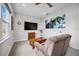 Comfortable bonus room provides a relaxing space with a large TV and cozy recliner at 308 Chantilly Trl, Bradenton, FL 34212