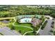 Aerial view of the community pool and recreation center, tennis courts, playground, and clubhouse at 308 Chantilly Trl, Bradenton, FL 34212