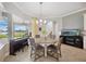 Dining area with a round table with a view of the lake at 308 Chantilly Trl, Bradenton, FL 34212