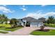 Beautiful two-story home with a three-car garage and a well-manicured front yard at 308 Chantilly Trl, Bradenton, FL 34212