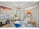Inviting living room with a tray ceiling and natural light, connected to the open floor plan at 308 Chantilly Trl, Bradenton, FL 34212