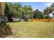 The backyard has lush lawn, mature trees, and a privacy fence, offering a private outdoor retreat at 3102 16Th W Ave, Bradenton, FL 34205