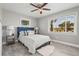 Bright bedroom with a comfy bed, ceiling fan, and a view to the exterior at 3102 16Th W Ave, Bradenton, FL 34205