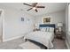 Serene bedroom with a cozy bed, ceiling fan, neutral decor, and natural lighting at 3102 16Th W Ave, Bradenton, FL 34205