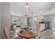 Open-concept dining area with view to kitchen and living area with lots of natural light at 3102 16Th W Ave, Bradenton, FL 34205