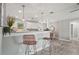 Modern kitchen with sleek countertops, pendant lighting, and an open view to the dining area at 3102 16Th W Ave, Bradenton, FL 34205