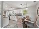 Bright kitchen and dining area with white cabinets, granite counters, and lots of natural light at 3102 16Th W Ave, Bradenton, FL 34205
