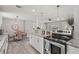 Stylish kitchen and dining area with white cabinets, granite countertops, and stainless steel oven at 3102 16Th W Ave, Bradenton, FL 34205