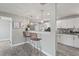 Stylish kitchen featuring a breakfast bar, stainless steel appliances, and open layout to other living spaces at 3102 16Th W Ave, Bradenton, FL 34205