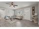 Bright living room with stylish decor, including a ceiling fan and inviting front door at 3102 16Th W Ave, Bradenton, FL 34205