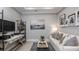 Comfortable living room featuring a desk, shelving, and modern decor at 3118 Torta Ct, Bradenton, FL 34211