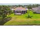 Aerial view of backyard with screened-in lanai at 327 64Th Avenue E Cir, Bradenton, FL 34203