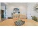 The dining room features a light wood table and chairs, with art and decor at 327 64Th Avenue E Cir, Bradenton, FL 34203