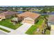 Beautiful single Gathering home showcasing a well-manicured lawn and picturesque waterfront views at 327 64Th Avenue E Cir, Bradenton, FL 34203