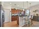 Bright kitchen with granite counters, wood cabinets, stainless steel appliances, and seating at the breakfast bar at 327 64Th Avenue E Cir, Bradenton, FL 34203