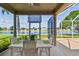 Screened-in lanai with lake views at 327 64Th Avenue E Cir, Bradenton, FL 34203