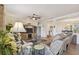 Spacious living room featuring a view to the kitchen and foyer with stylish decor at 327 64Th Avenue E Cir, Bradenton, FL 34203