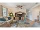 Welcoming living room with a large TV, comfortable seating, and stylish decor at 327 64Th Avenue E Cir, Bradenton, FL 34203