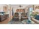 Modern living room with a kitchen view, and comfortable leather seating at 327 64Th Avenue E Cir, Bradenton, FL 34203