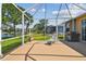 Relax in style on this screened-in patio, featuring comfortable seating and a picturesque view of the serene lake at 327 64Th Avenue E Cir, Bradenton, FL 34203