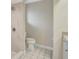 Bathroom featuring tiled walk-in shower, toilet and vanity with white cabinetry at 3510 Shawn St, Punta Gorda, FL 33980