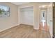 Empty bedroom with wood-look flooring and an open closet with a window view at 3510 Shawn St, Punta Gorda, FL 33980