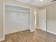 Bedroom features an open closet and wood-look flooring at 3510 Shawn St, Punta Gorda, FL 33980