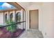 Inviting front porch area with neutral-colored door and attractive tile flooring at 3510 Shawn St, Punta Gorda, FL 33980