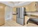 Kitchen with stainless steel refrigerator and modern appliances, light wood cabinets and countertops at 3510 Shawn St, Punta Gorda, FL 33980