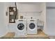 Laundry room featuring a washer, dryer, and sink on a tiled floor at 3510 Shawn St, Punta Gorda, FL 33980