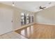 Bright living room features wood floors, vaulted ceiling, and arch windows at 3510 Shawn St, Punta Gorda, FL 33980